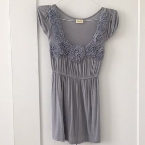 Grey blouse with flowers at neckline